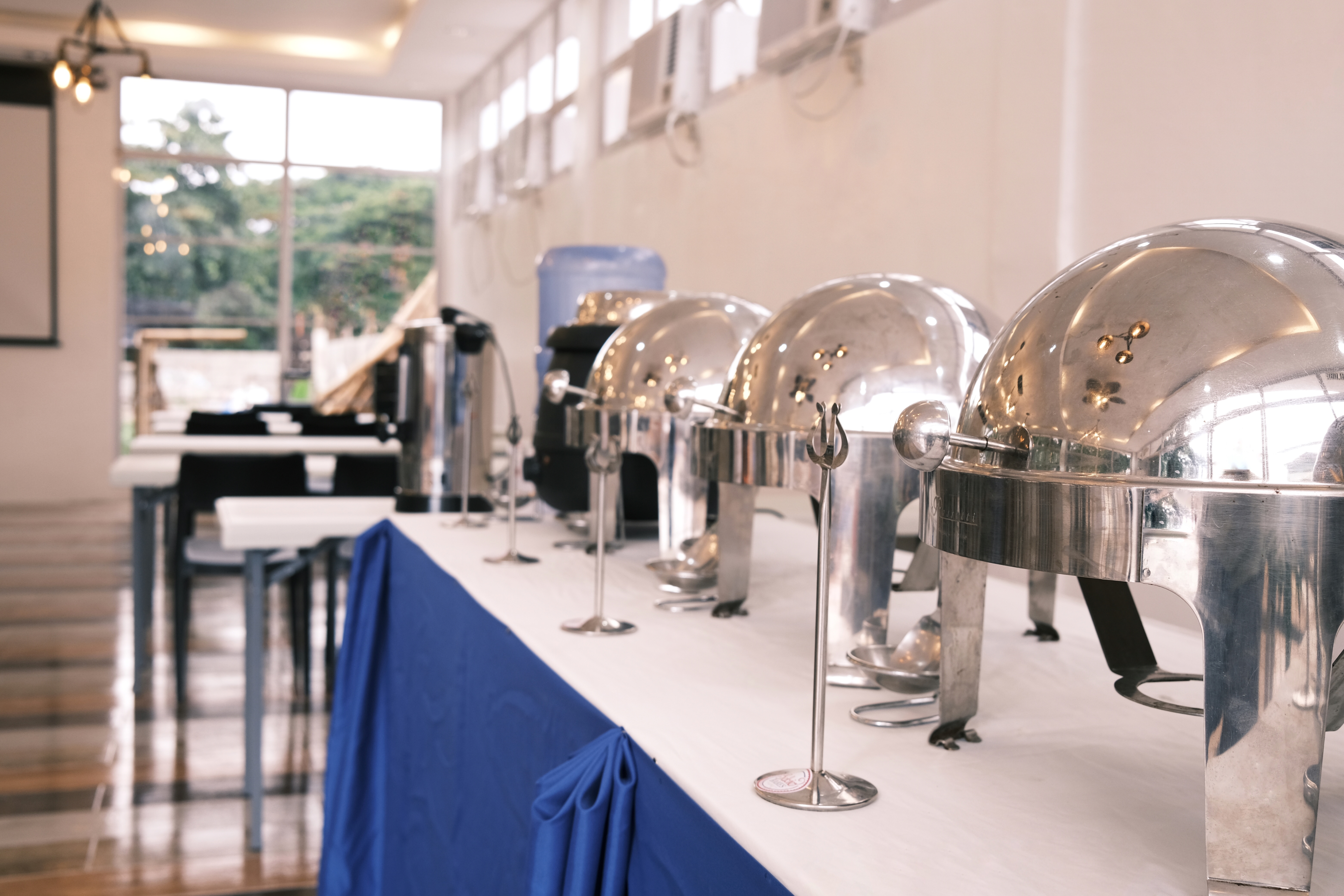 A polished chafing-dish buffet set up at Ala Amid for event catering.