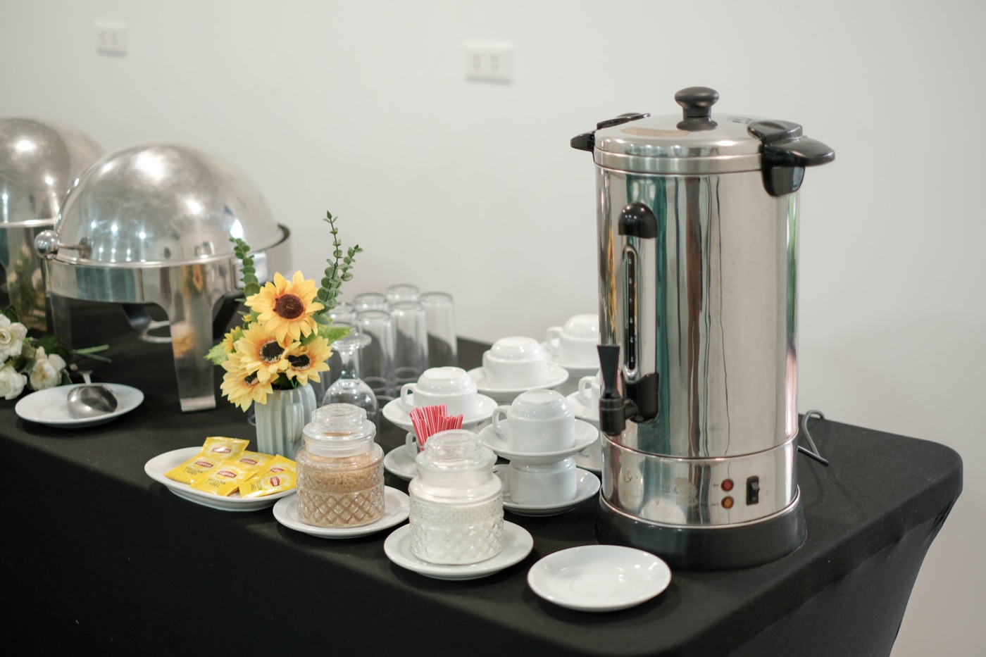 Coffee and tea station set up for an event in Andrea Garden Hall