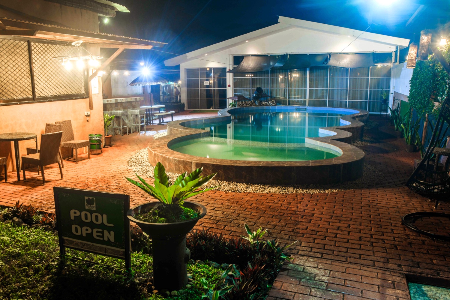 The poolside patio after dark