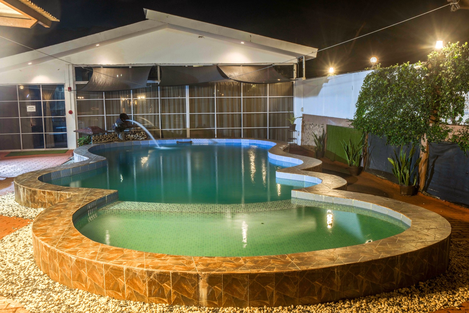 The pool at night, lit from within